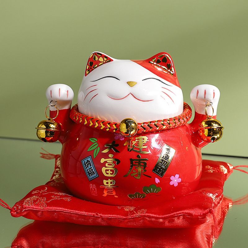 Chat porte-bonheur maneki neko en céramique émaillée, un talisman puissant pour votre bien-être et prospérité
