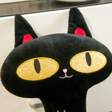 Peluche chat noir avec yeux dorés
