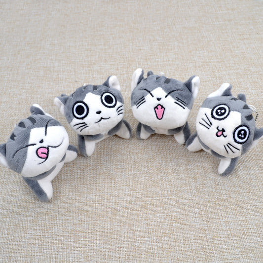 Peluche chat gris assis