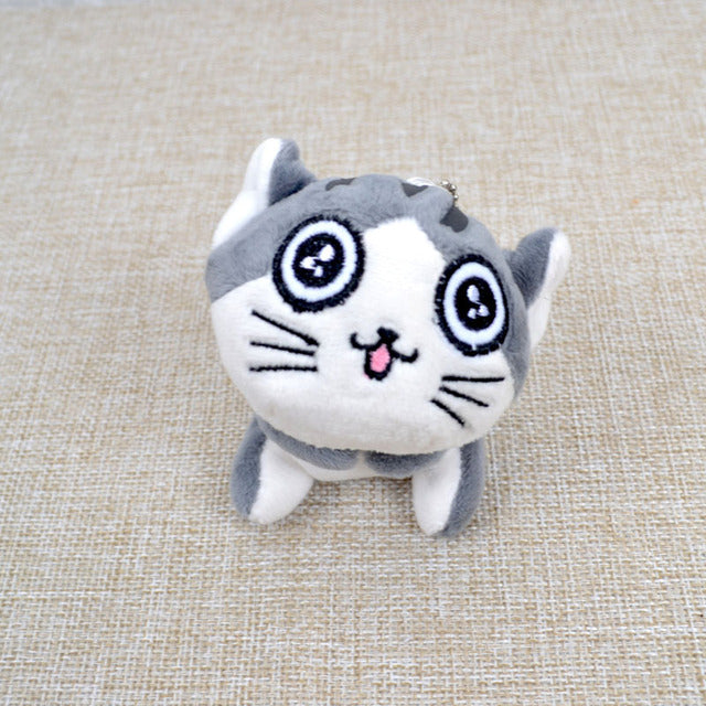 Peluche chat gris assis